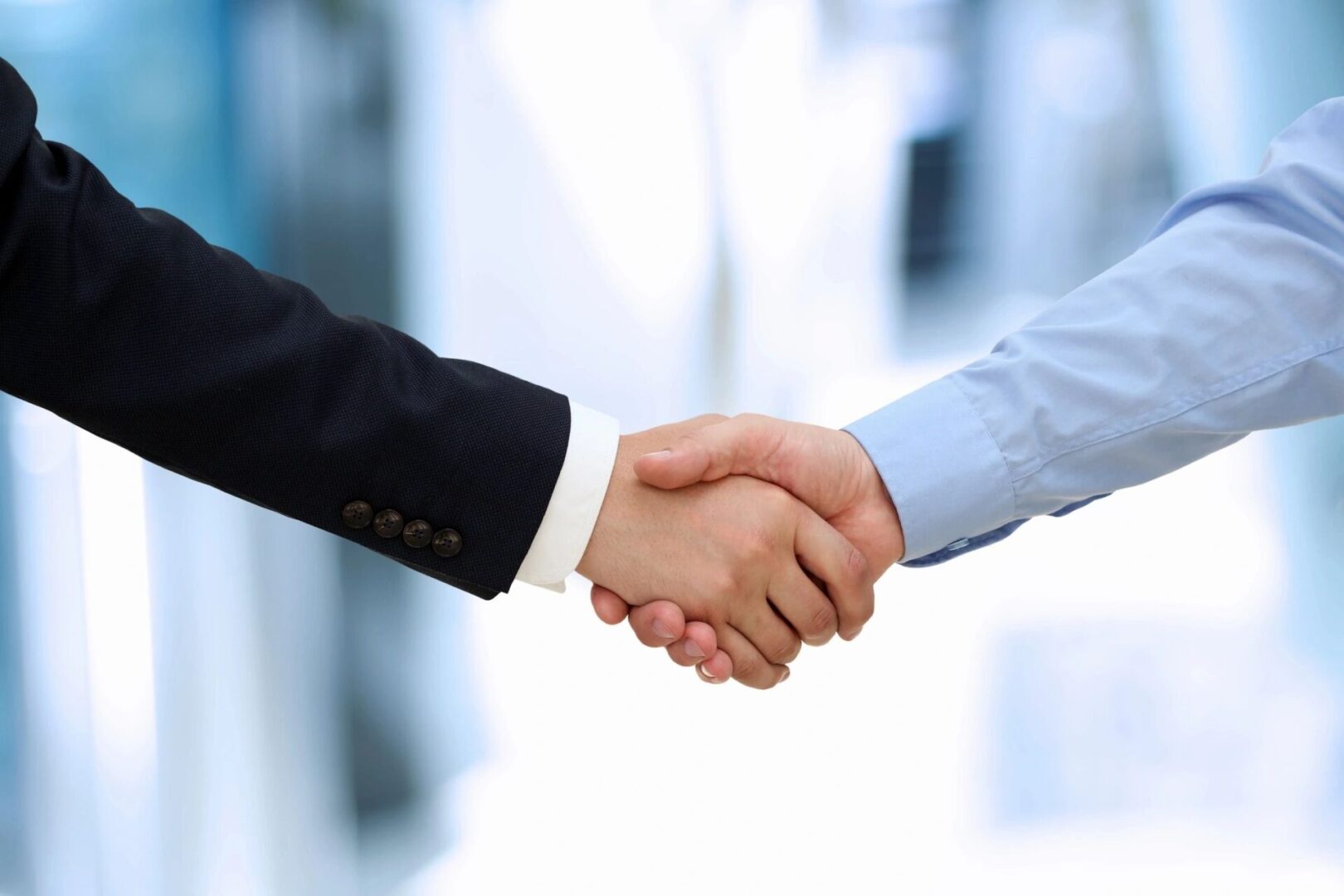 GoDaddy stock shot handshake hands business men